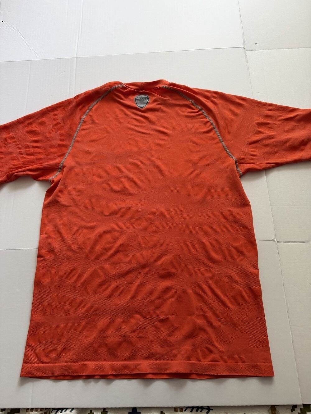2000s Nike Dri-Fit shirt orange color and a subtle camouflage. XL